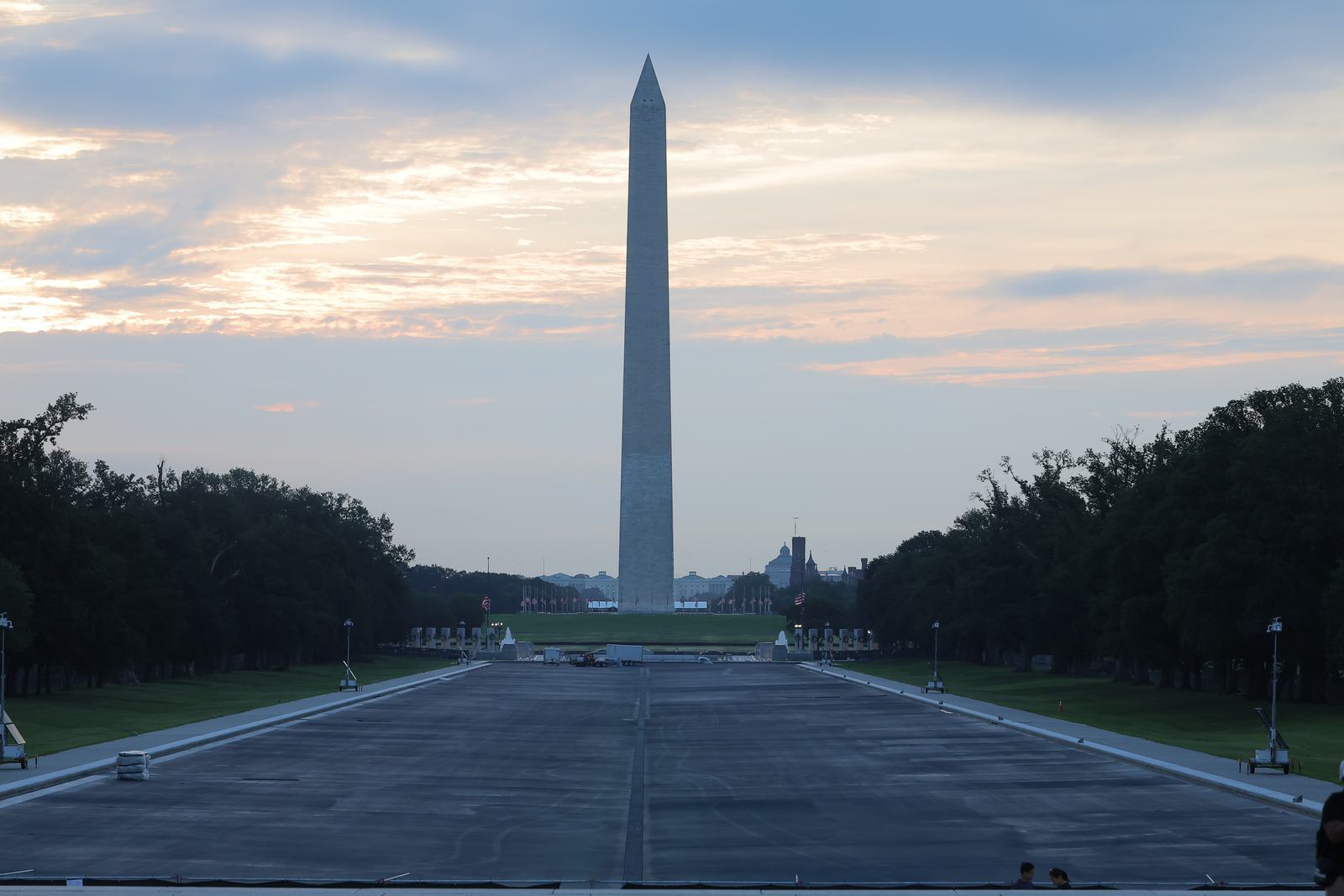The Washington Monument at dawn, seen down the Reflecting Pool from the Lincoln Memorial.