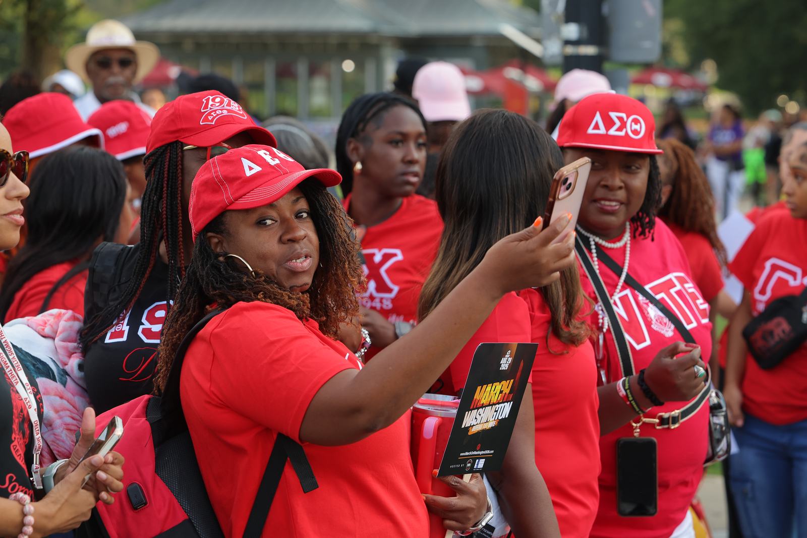 Members of Delta Sigma Theta Sorority in red gathered together at the march.