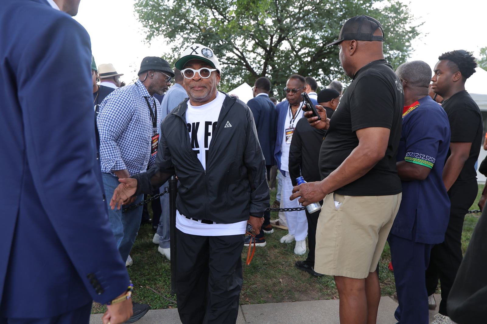 Organizers and leaders talking together in the crowd at the march.