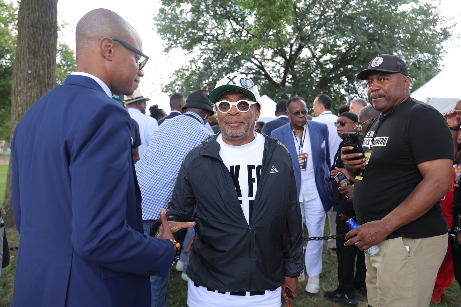 Organizers and leaders greeting one another in the crowd at the march.